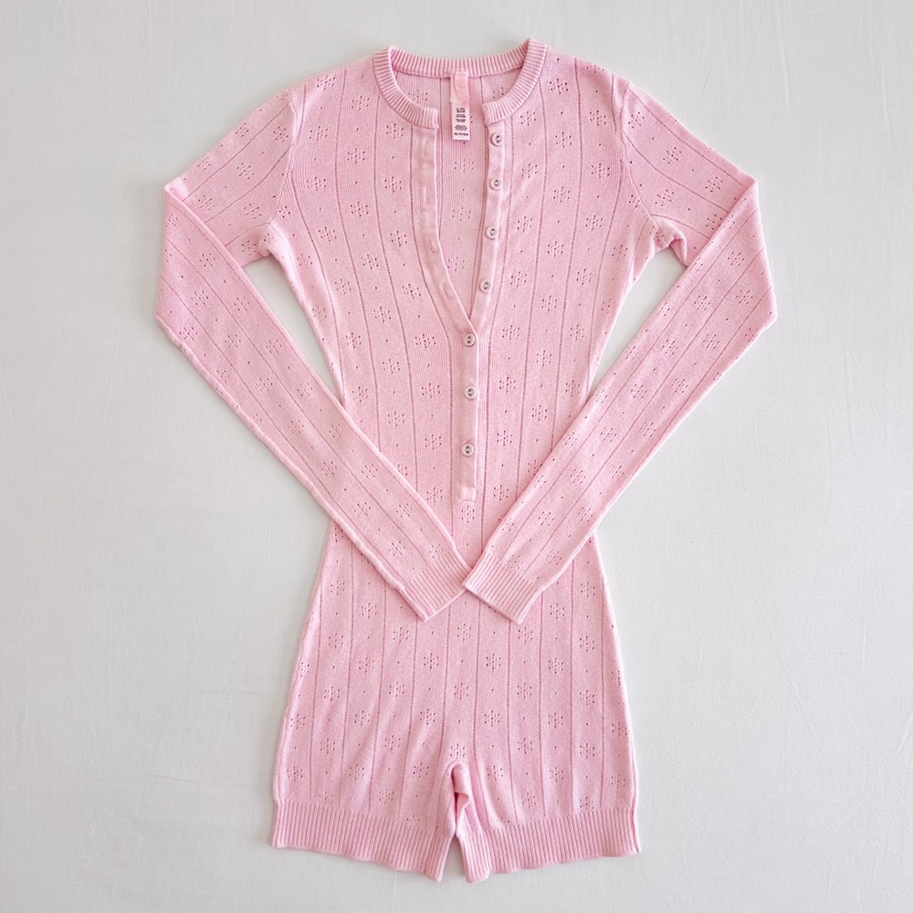 Skims Sweater Pointelle Henley Onesie in Baby Pink